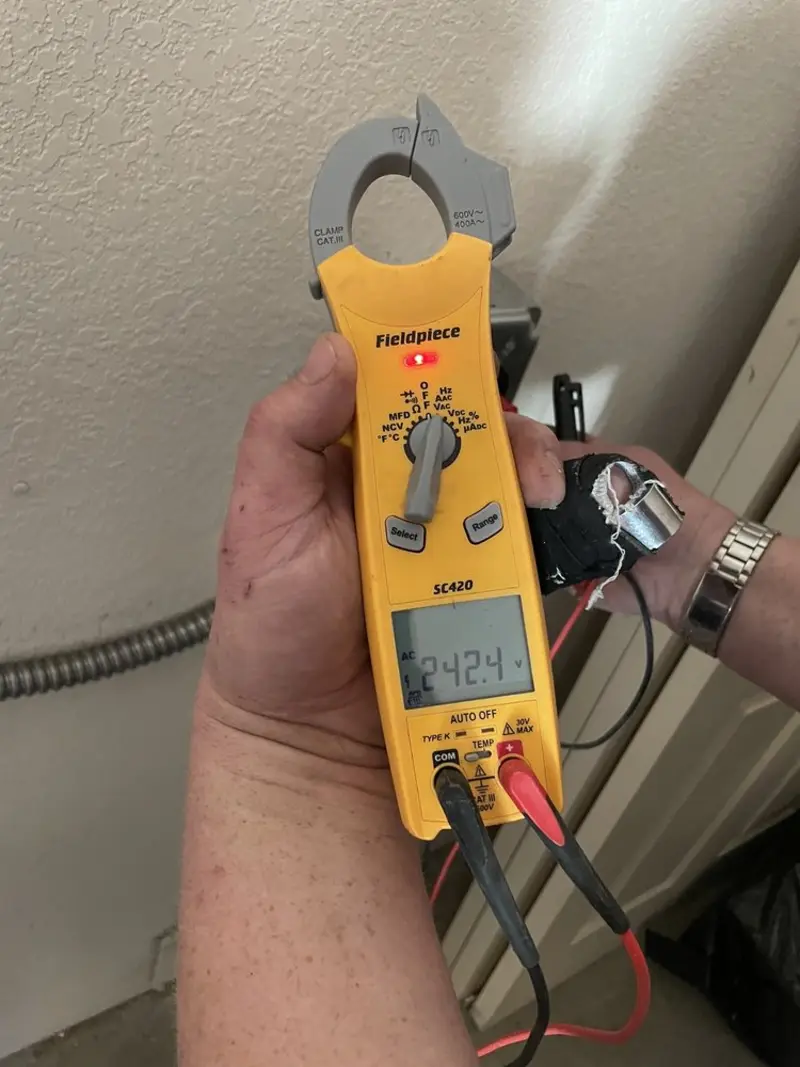 Voltage testing with clamp meter during Electrical Installation Services in Sidney
